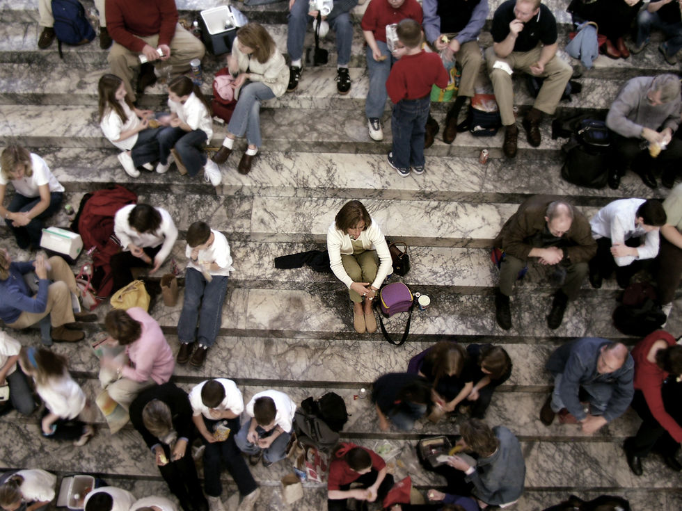 lady sitting in the middle of the crowd