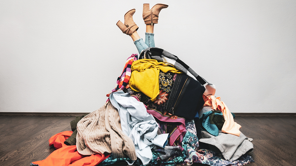 lady drowning in a pile of clothes