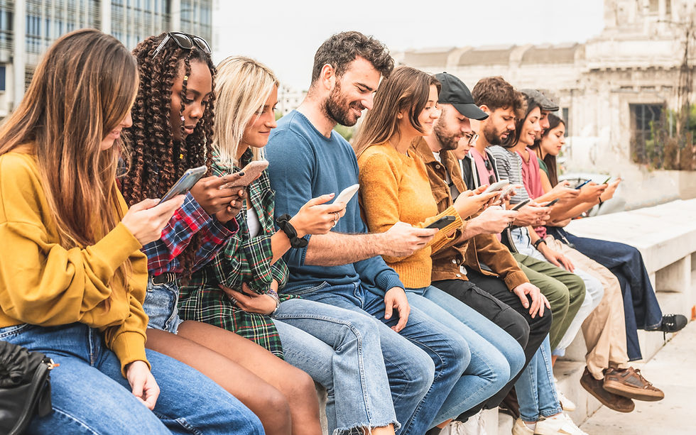multiracial group holding smartphones