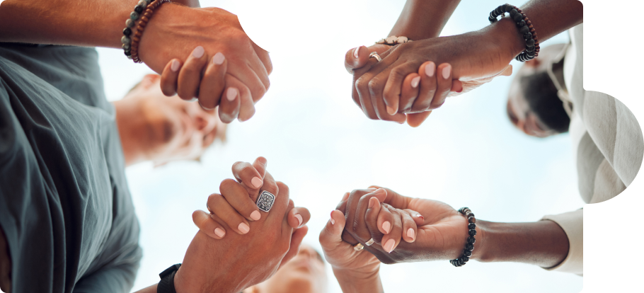 diverse people holding hands together, helping each other